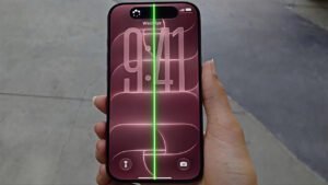 Close-up photograph of an iPhone 18 Pro Max display showing a prominent green vertical line screen problem.